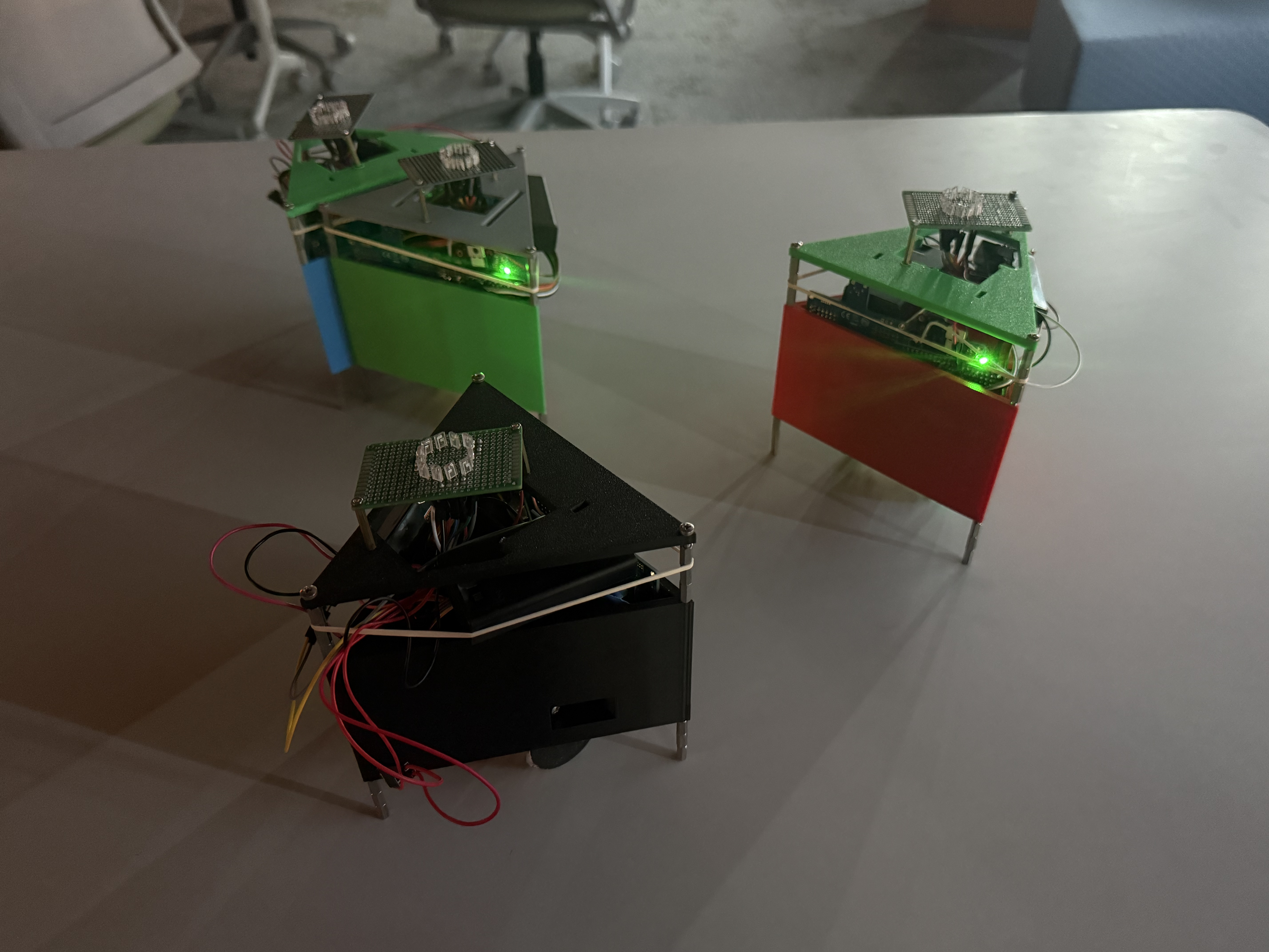 Three robots active with LEDs lit